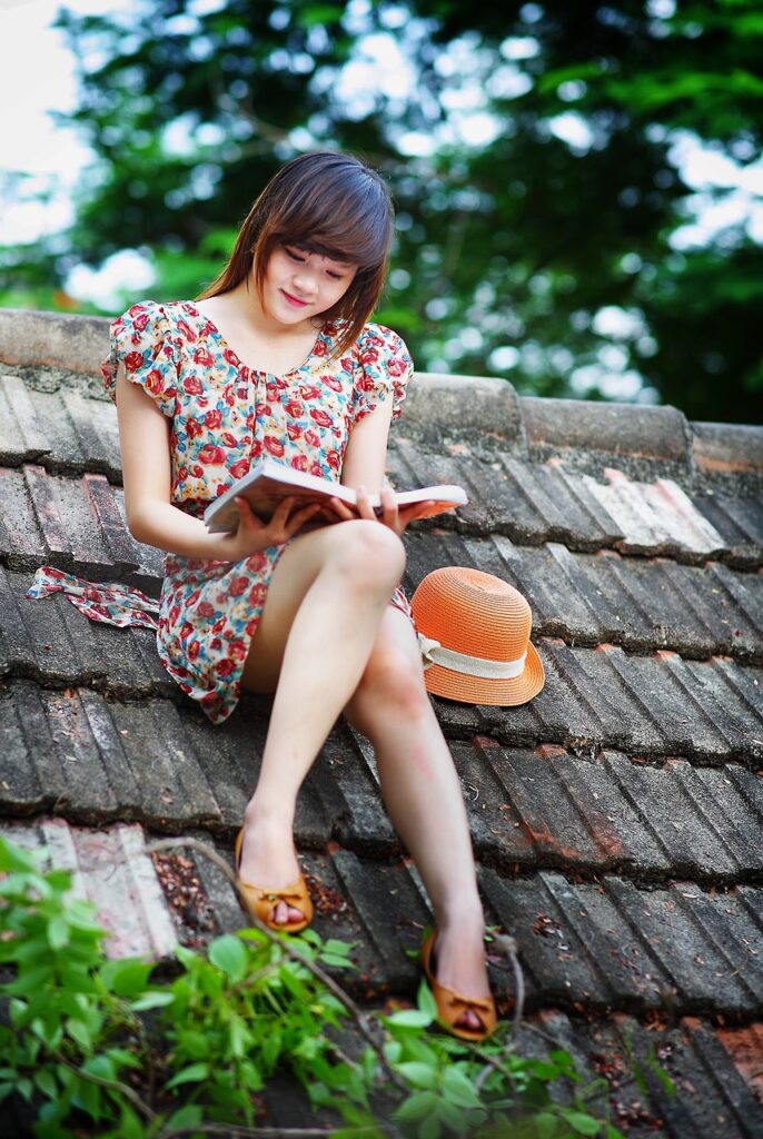 A girl reading on a roof