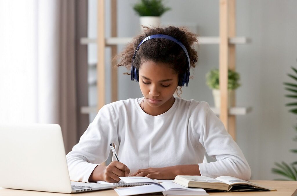 Student in front of a computer getting ready for the TOEFL